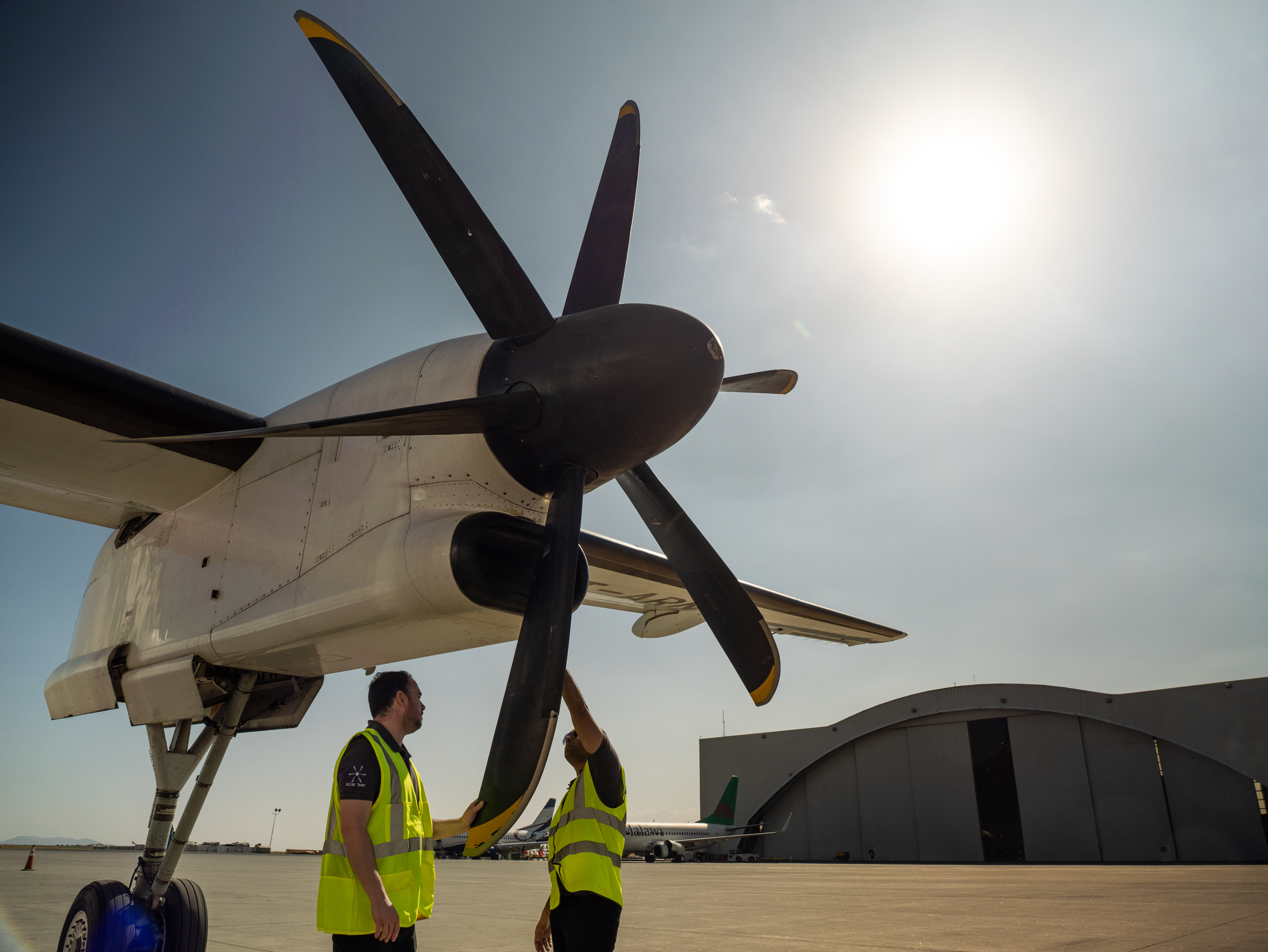 Dowty employees inspecting Dash 8-400 propeller